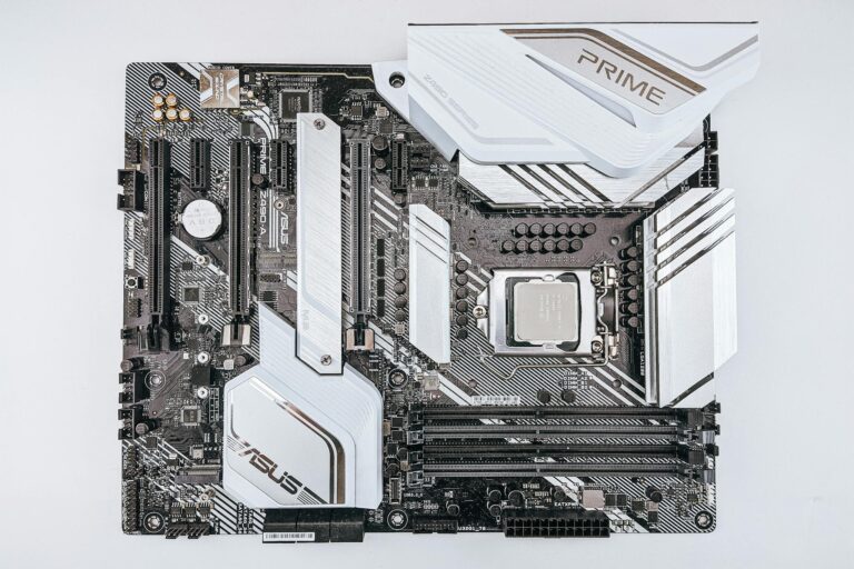 A detailed close-up of a modern ASUS motherboard showcasing intricate hardware components.