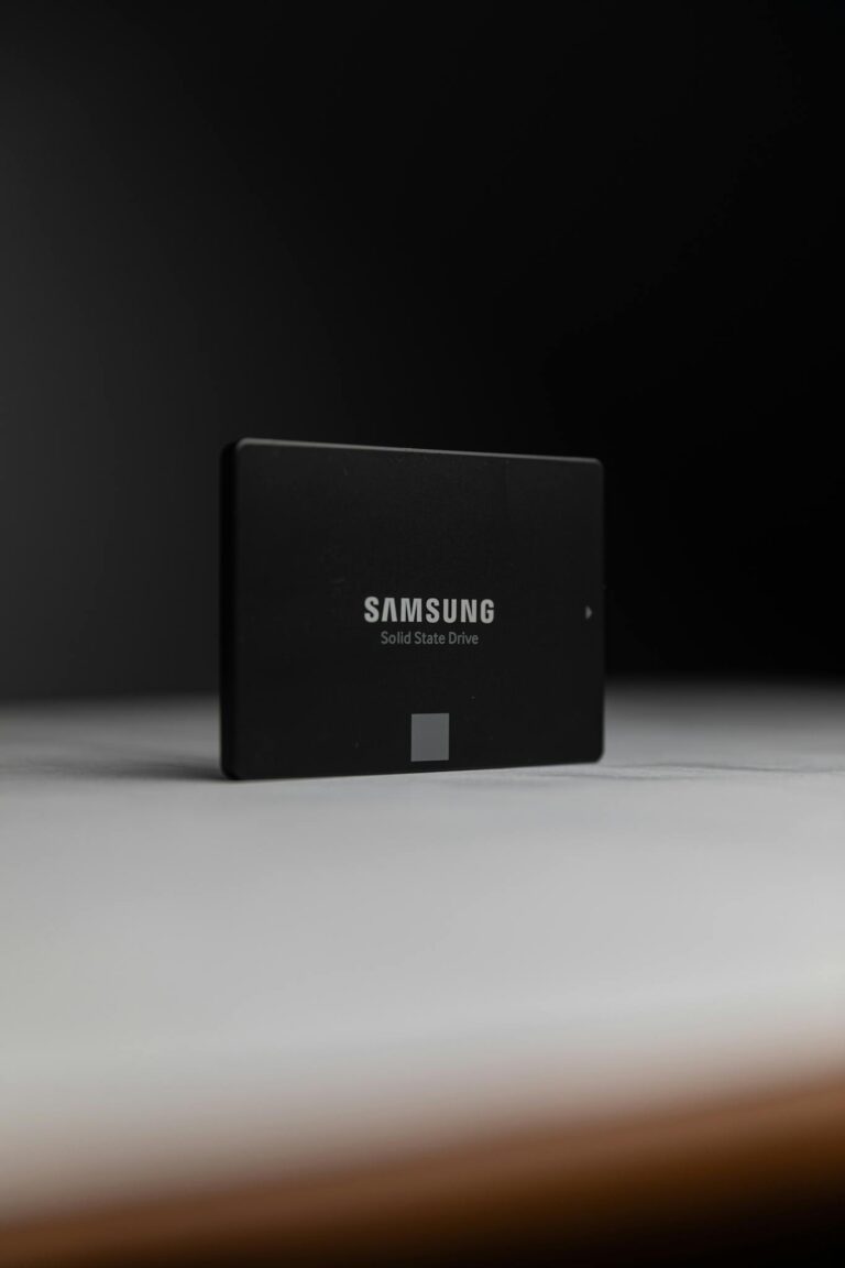 Close-up of a Samsung solid-state drive on a dark surface, modern technology.
